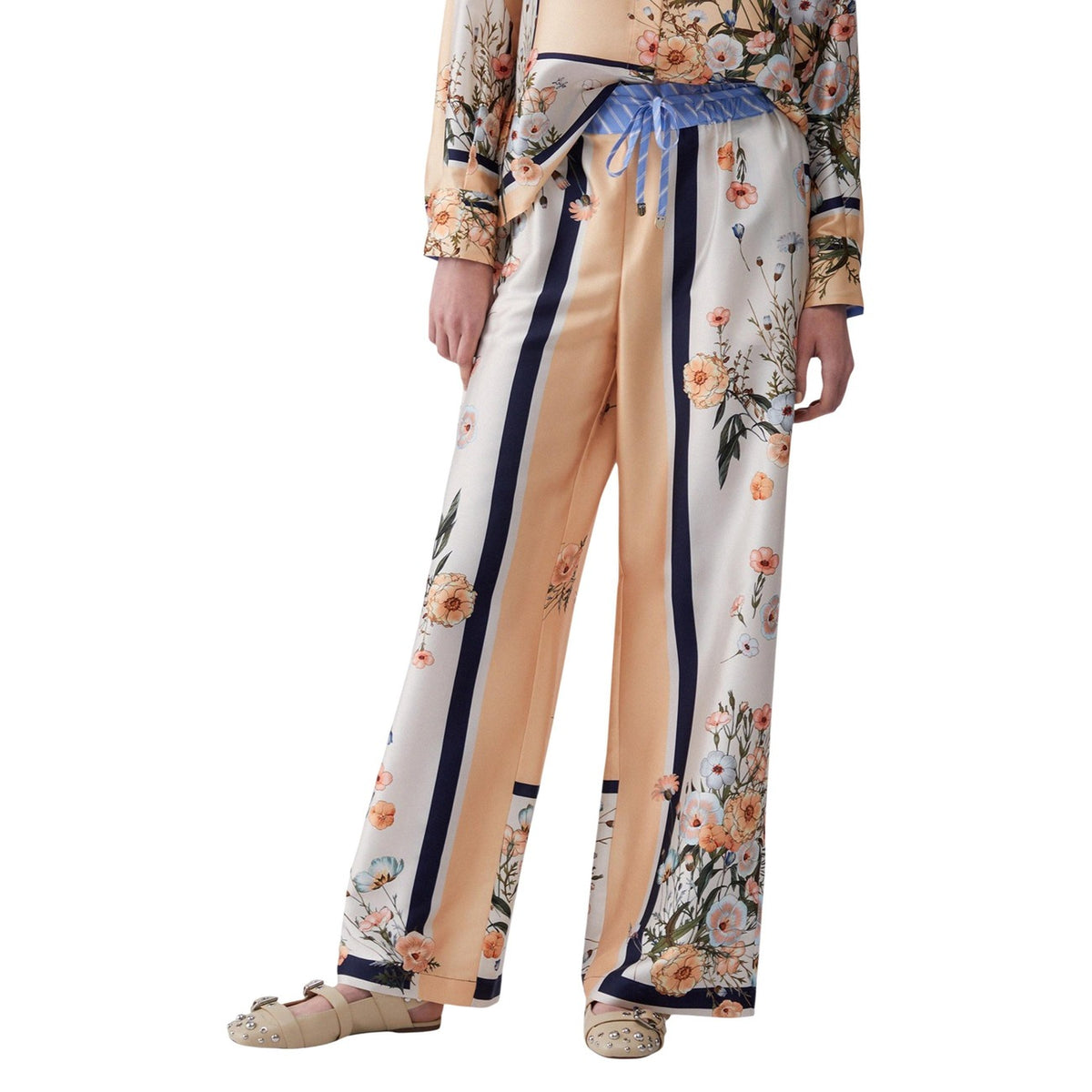 Liu-Jo Pantaloni Palazzo Floreali; tessuto leggero 100% poliestere, stampa righe e fiori, cintura a fiocco. Stile ricercato e comfort superiore. Vista frontale