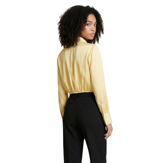 Artigli Camicia gialla Nodo Cotone; camicia a maniche lunghe con nodo frontale e colletto classico. 100% cotone, vestibilità fluida e stile sofisticato. Vista posteriore