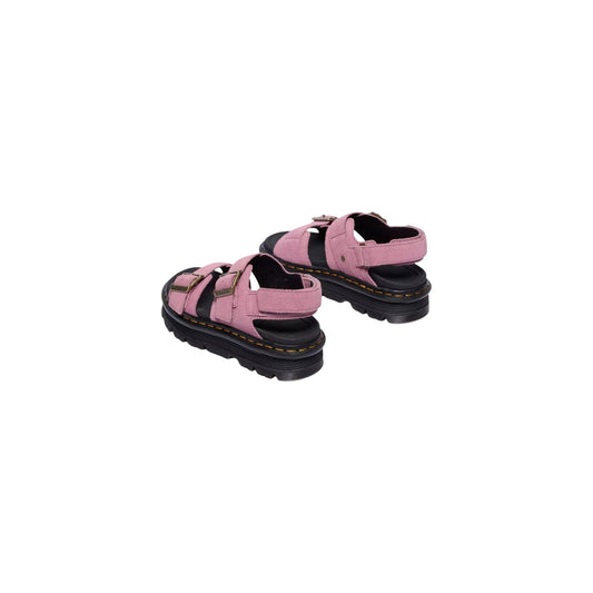Dr. Martens Sandalo Zebzag Platform; Rosa. 100% Pelle scamosciata. Tacco 4 cm, suola ammortizzata in EVA e PVC, chiusura regolabile con fibbie e cinturino. Design robusto con cuciture gialle. Posteriore