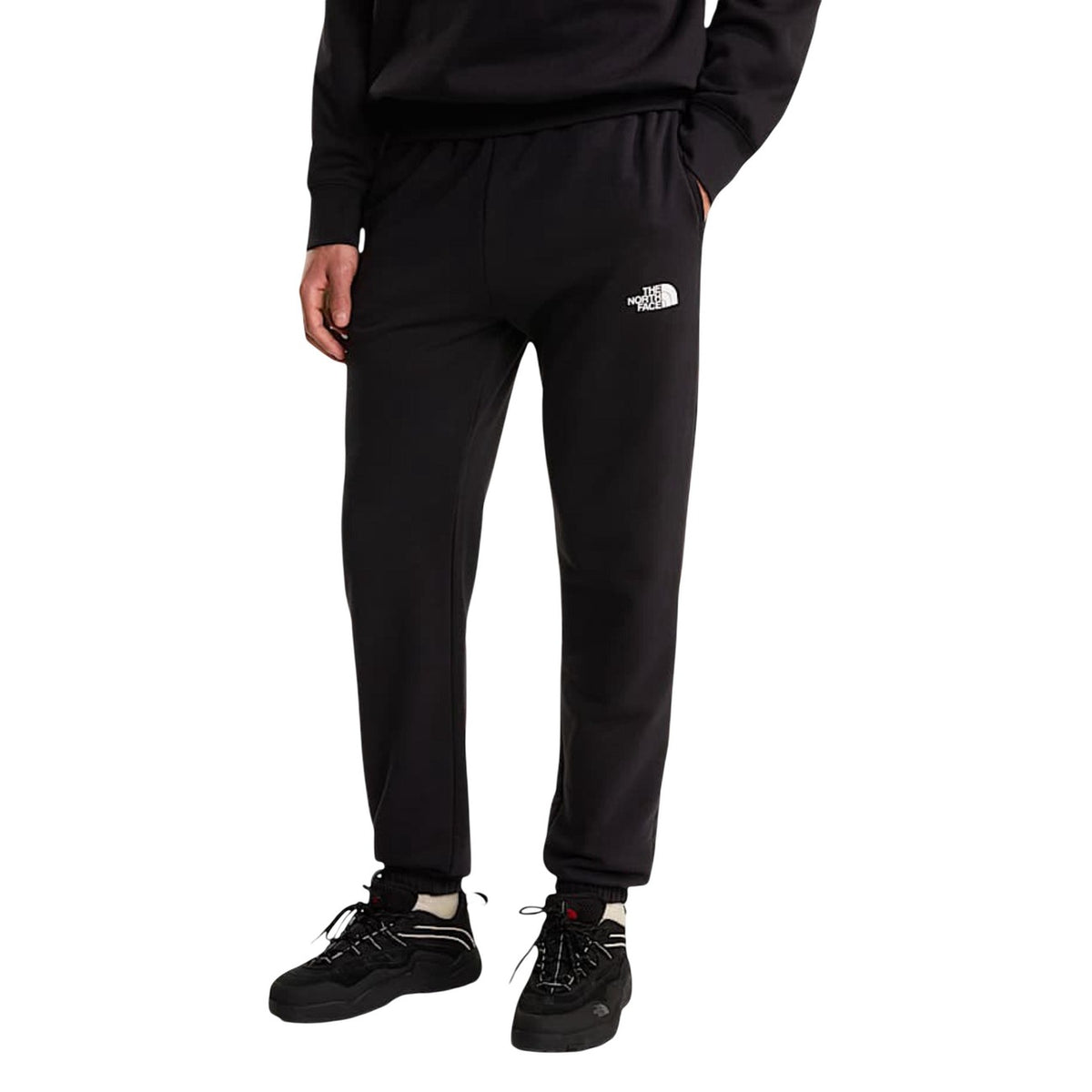 Joggers The North Face Simple Dome Light; 68% cotone, 32% poliestere, 295g. Vita con coulisse, interno spazzolato, orli elastici. Pantaloni sportivi leggeri, caldi e traspiranti. Colore nero