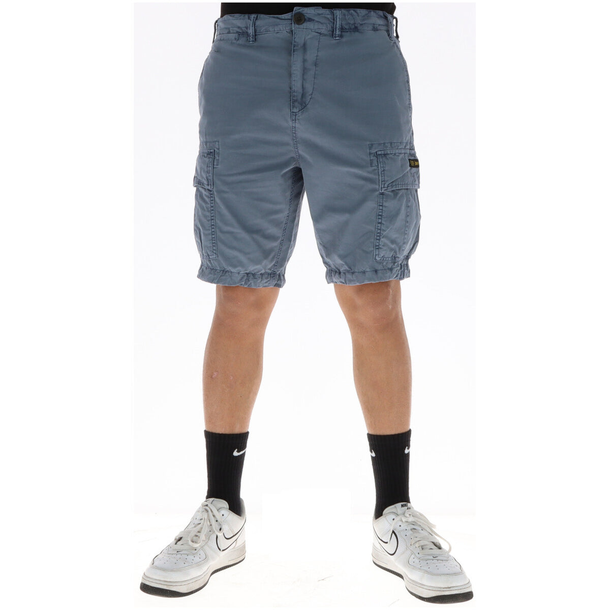 Bermuda Cargo Superdry Azzurro grigio ; 100% Cotone Twill. Sei tasche funzionali, vestibilità dritta, patch logo. Tessuto resistente e traspirante. Ideale per il tempo libero e l'estate.