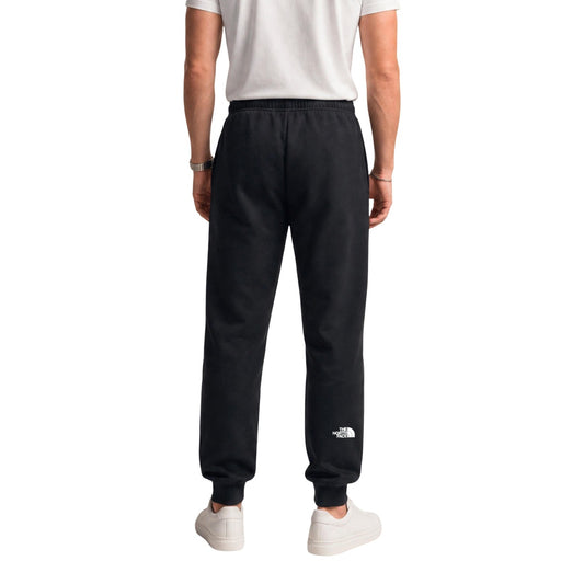 Pantaloni tuta The North Face uomo neri modello M EVO BOX HD REG PNT T. Pantalone jogger felpato nero con coulisse in vita, polsini alla caviglia e doppio logo applicato davanti e dietro, stile casual, sportivo e streetwear.