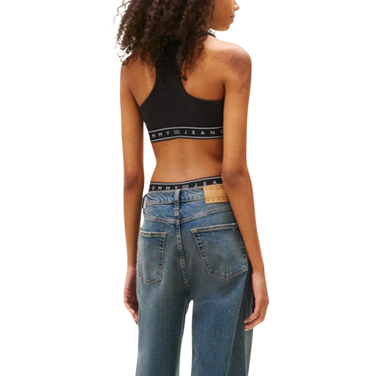 Top Tommy Hilfiger Jeans donna nero sportivo con logo elastico - vista posteriore retro indossato da modello