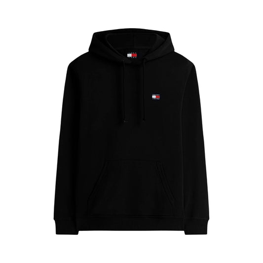 Felpa nero Tommy Jeans con Cappuccio; 100% Cotone Rigenerato. Tessuto pesante felpato, logo ricamato, vestibilità regular. Calda, sostenibile e ideale per il tempo libero. Frontale stesa