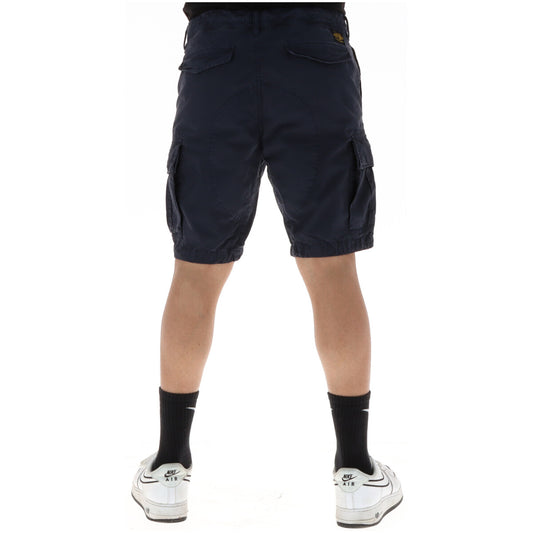 Bermuda Cargo Superdry Blu Navy; 100% Cotone Twill. Sei tasche funzionali, vestibilità dritta, patch logo. Tessuto resistente e traspirante. Ideale per il tempo libero e l'estate. Vista pos