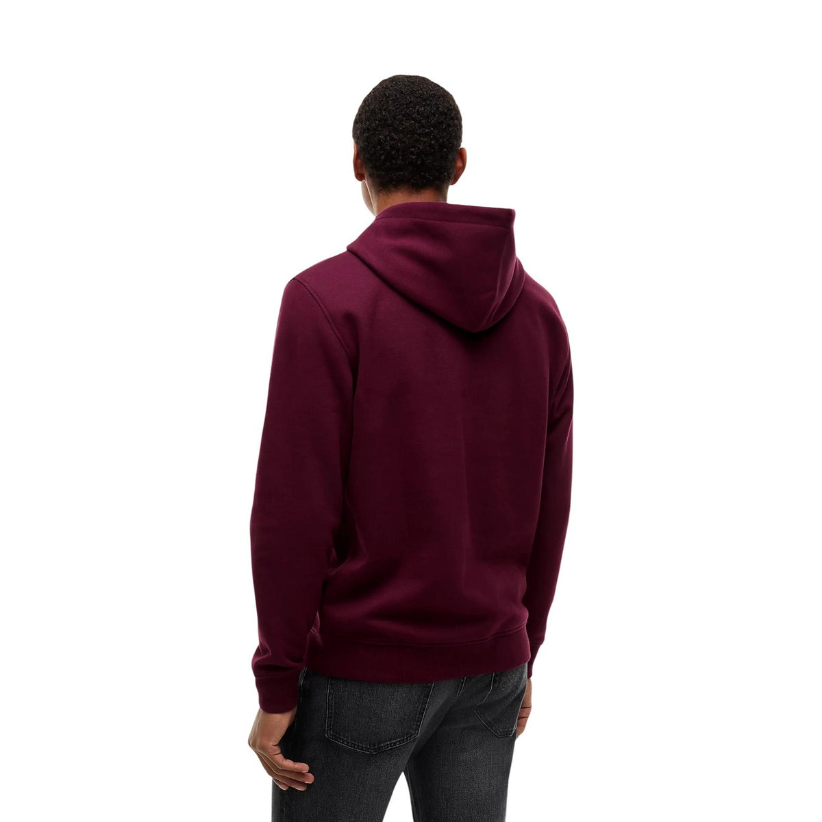 Felpa Tommy Jeans uomo Calypso Berry DM0DM20746. Felpa con cappuccio e tasca a marsupio in cotone e poliestere, vestibilità regular con bordi a costine e logo classico stampato sul petto, abbigliamento uomo autunno inverno.