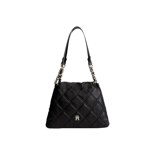 Borsa Tommy Hilfiger donna nera trapuntata AW0AW18716. Borsa tote media a spalla e a mano in ecopelle trapuntata nera con logo metallico TH e catene dorate sui manici, borsa casual chic ed elegante per tutte le stagioni.