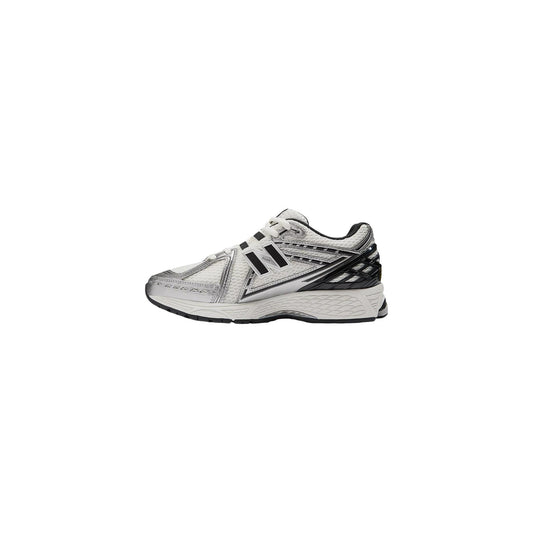 Scarpe New Balance 1906 unisex argento e bianche GC1906ER. Sneakers running basse metallizzate in mesh e materiale sintetico con ammortizzazione ABZORB SBS, supporto Stability Web e suola in gomma, scarpe sportive autunno inverno.