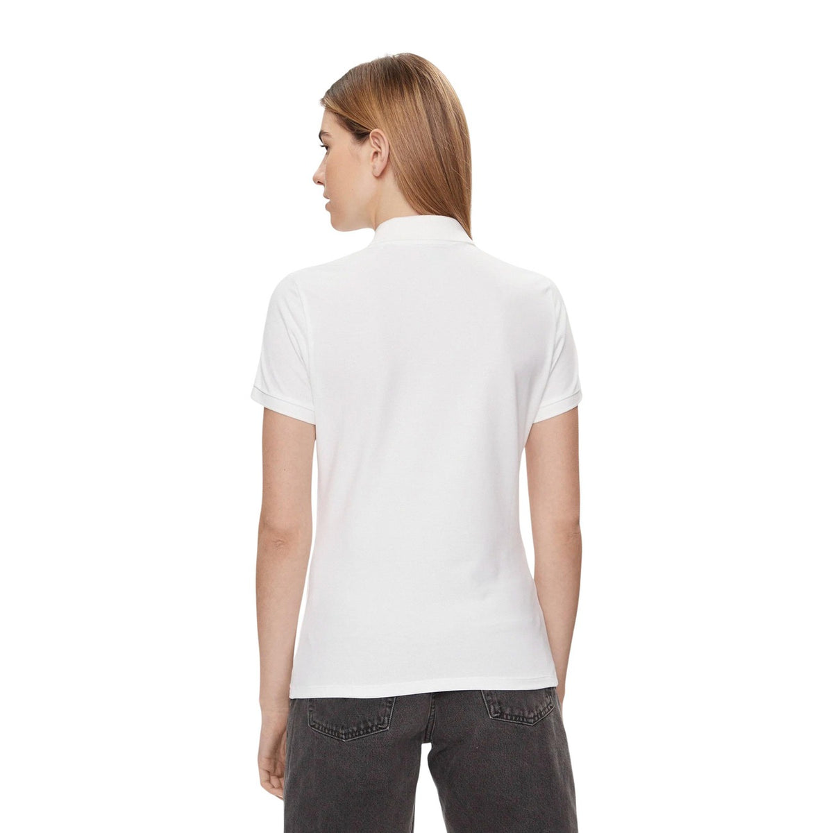 Polo Levi's donna bianca modello 52599-0000. Maglietta a maniche corte tipo polo in cotone stretch bianco con colletto classico, scollatura a tre bottoni e micro logo sul petto, stile casual e sportivo.
