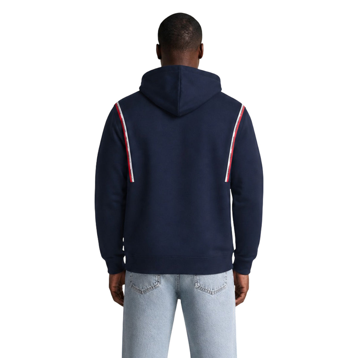 Felpa Cappuccio Uomo Tommy Hilfiger Jeans; Blu. 100% cotone rigenerato con tasca a marsupio, bande logo sulle spalle e scritte ricamate. Polsini a coste e vestibilità regolare, stile urban-casual. Vista posteriore