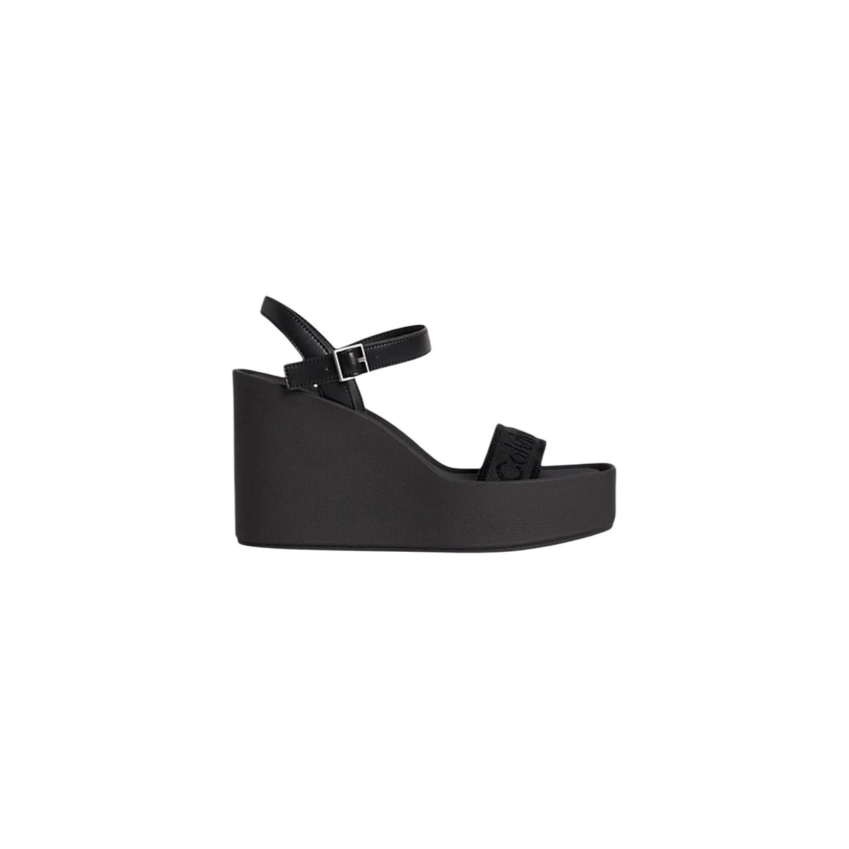 Calvin Klein Wedge Sandals; zeppa 7cm, tecnologia Airfit® anti-fatica, tomaia mesh e ecopelle. Il sandalo platform leggero e iconico. Colore nero