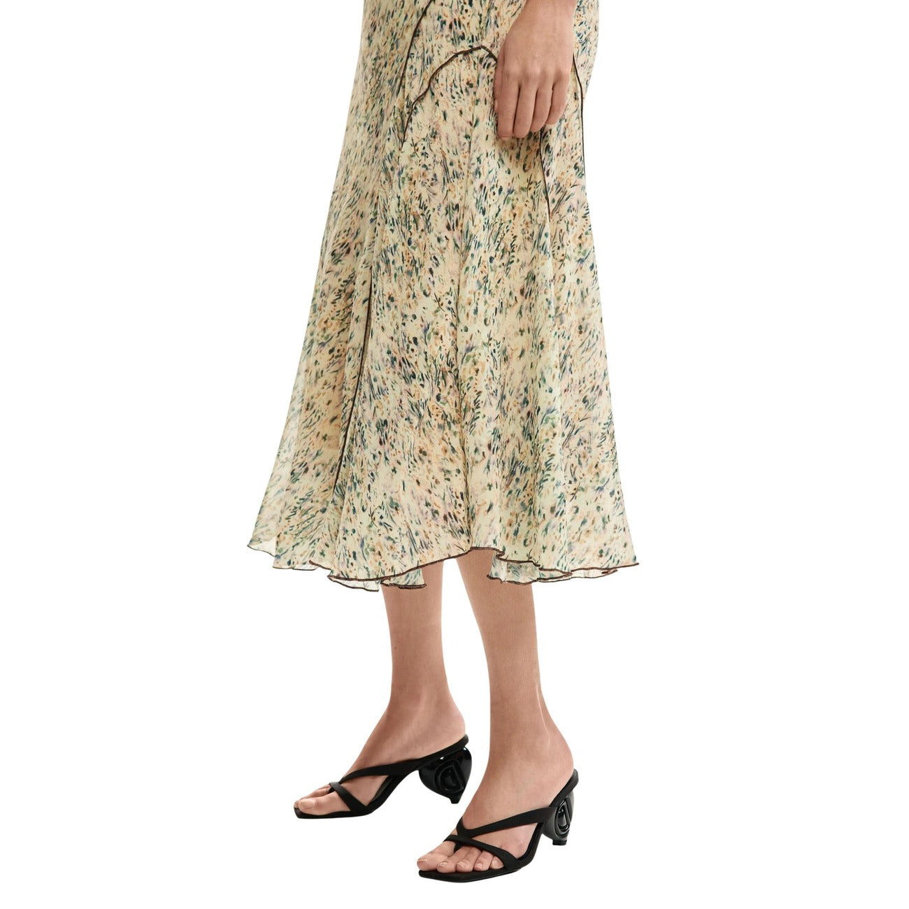 Gonna Midi Desigual PE26; stampa marmorizzata, dettagli floreali, profili a contrasto, chiusura zip. Il tocco fluido e sostenibile per ogni occasione. Vista laterale