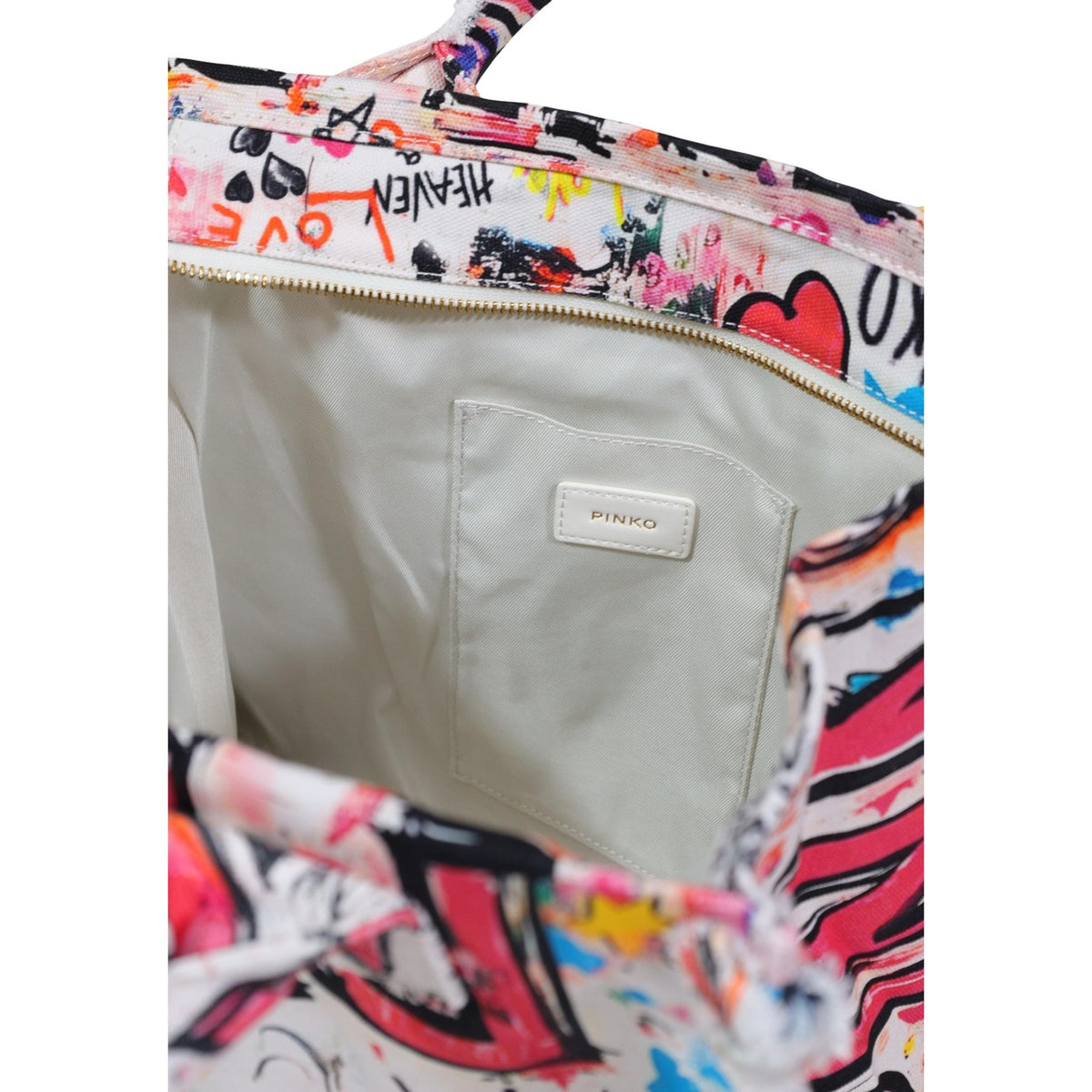 Borsa Shopper Pinko Canvas; 100% cotone, stampa street art, bordi sfrangiati, formato grande. L'accessorio must-have versatile e originale.