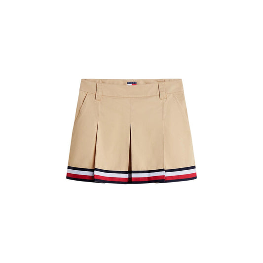 Gonna Tommy Jeans donna Gentle Gold DW0DW22969. Minigonna a pieghe in stile college in 100% cotone biologico, colore oro beige con tasche ad angolo e nastro riga Tommy sul fondo, abbigliamento donna autunno inverno.