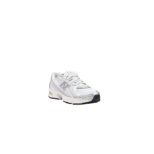 Sneakers New Balance donna beige modello U7402F3. Scarpe da ginnastica e corsa stile rétro in mesh e materiale sintetico beige chiaro, con suola spessa ammortizzata ABZORB, allacciatura classica e design casual sportivo per tutte le stagioni.