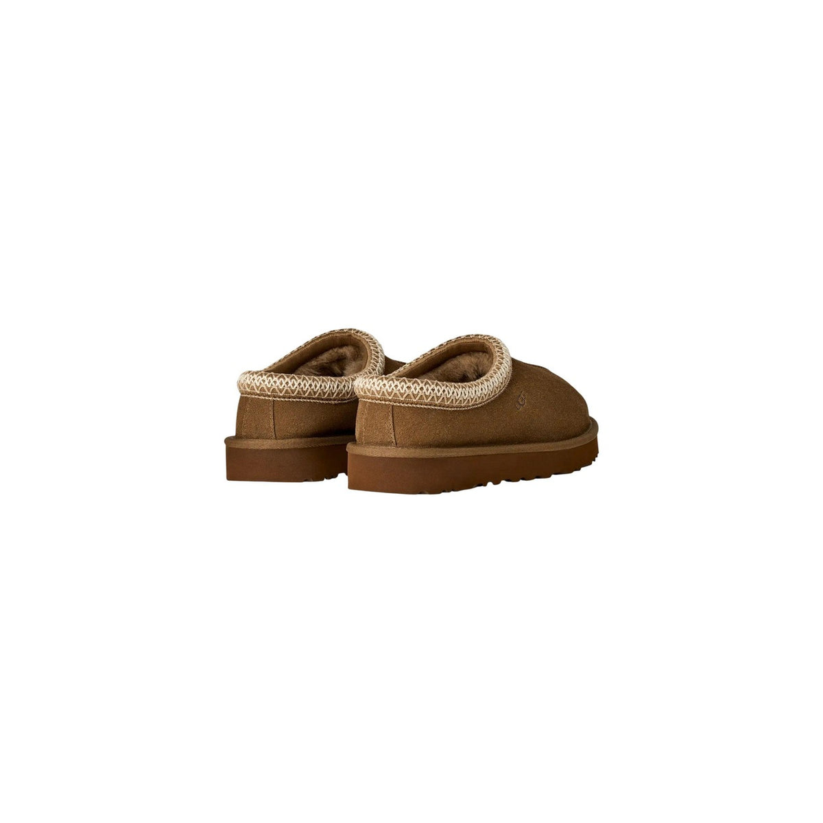 Ciabatte UGG Tasman donna camoscio 1174470 colori grigio nero e bronzo. Sabot bassi senza tacco in pelle scamosciata con bordo ricamato UGGbraid, interno in vero montone e suola ammortizzata in EVA da canna da zucchero.