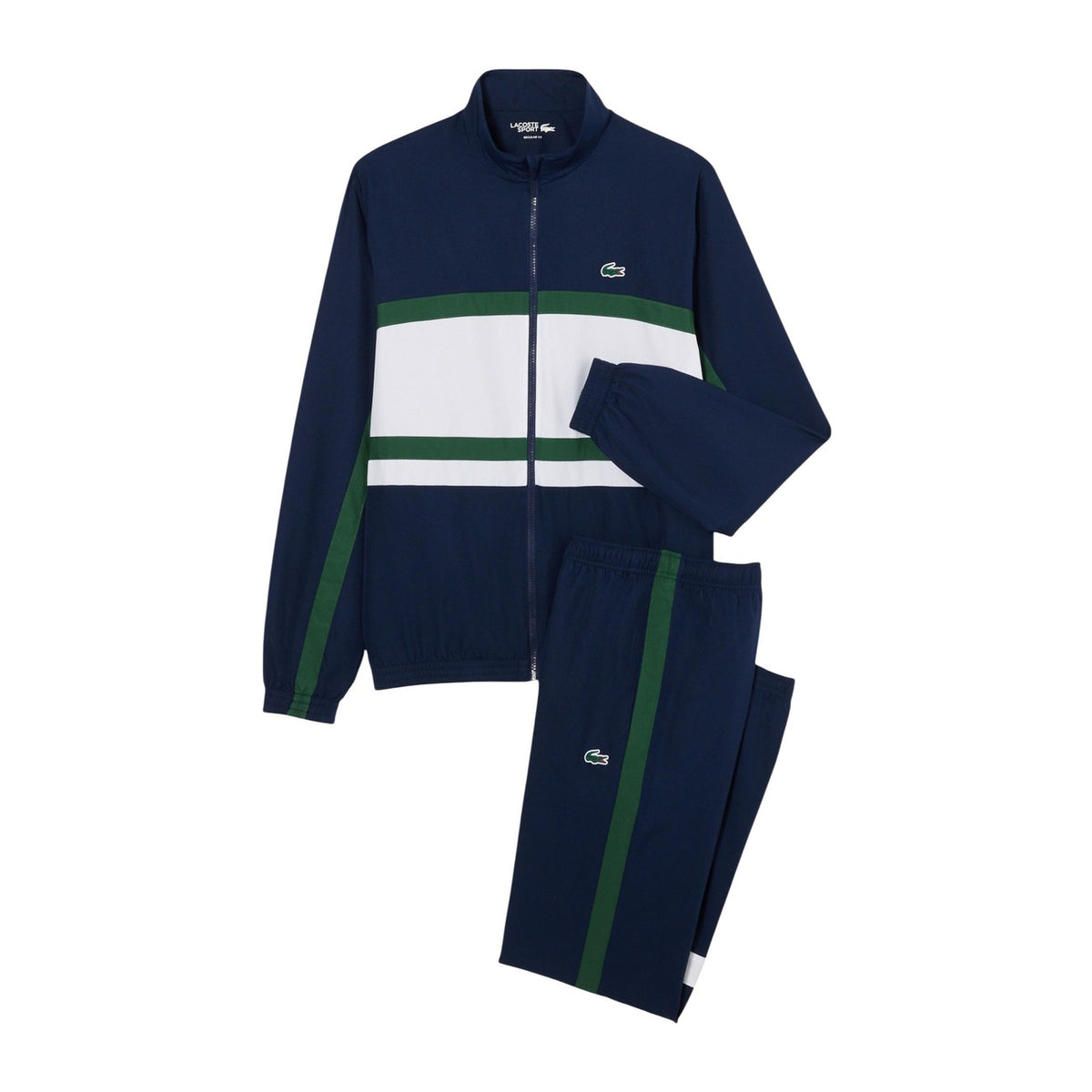 Lacoste Tennis Tracksuit Navy/White; 100% poliestere, resistente all'acqua, fondo gamba con zip. La tuta da tennis professionale classica e traspirante. Vista frontale stesa