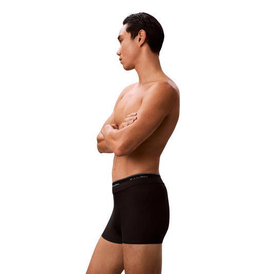 Slip Mare Calvin Klein Vita Media; Nero. Jersey di nylon elasticizzato "Quick Dry". Doppia fascia logata tono su tono, interamente foderato, tessuto anti-umidità Laterale 