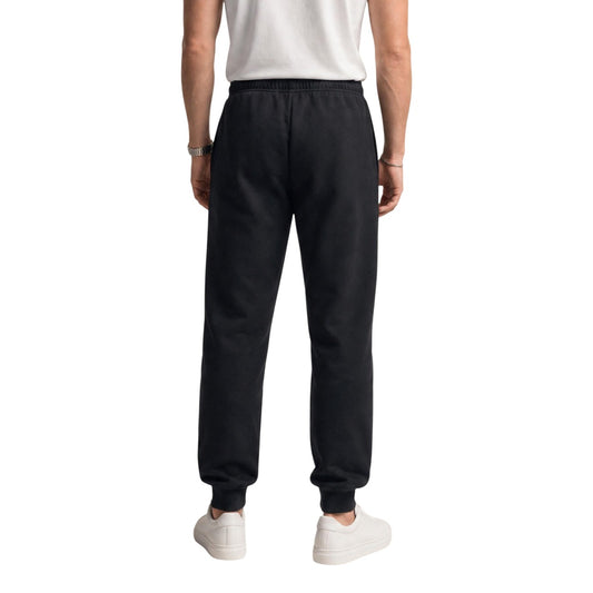 Pantaloni tuta The North Face uomo neri modello M EVO SD REG JOGGER. Pantalone jogger felpato invernale nero con polsini alle caviglie, elastico in vita e tasche stile sportivo, streetwear e da allenamento.