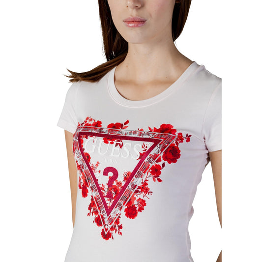 T-shirt Guess Rosa Chiaro; 95% Cotone, 5% Elastam. Logo triangolo con fiori, vestibilità slim, maniche corte. Ideale per look casual-chic Primavera/Estate.