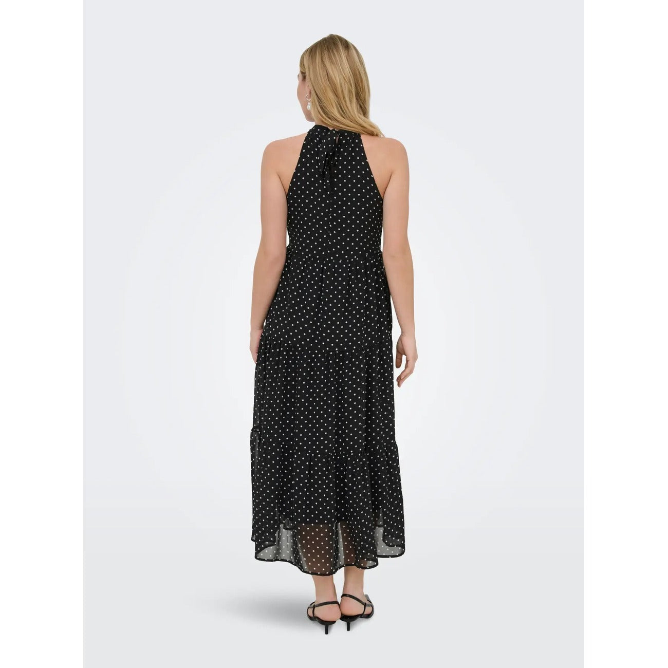 Abito Lungo Donna Nero a Pois Only; Vestito smanicato oversize con scollo all'americana, chiusura con zip e dettaglio fiocco. Tessuto leggero e fluido quattro stagioni, stile casual-elegante per eventi. Posteriore 