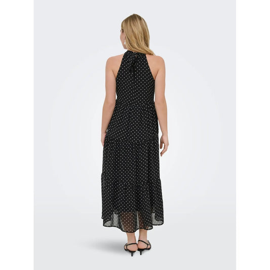 Abito Lungo Donna Nero a Pois Only; Vestito smanicato oversize con scollo all'americana, chiusura con zip e dettaglio fiocco. Tessuto leggero e fluido quattro stagioni, stile casual-elegante per eventi. Posteriore 