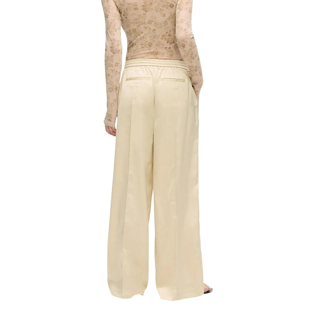 Pantaloni Palazzo Raso; 100% Poliestere. Vita elastica, cuciture pintuck, silhouette fluida. Pantalone donna elegante, luminoso e confortevole per eventi e tempo libero. Vista posteriore 