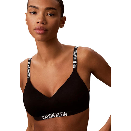 Reggiseno Bralette Donna Nero Calvin Klein; Modello leggermente imbottito senza ferretto in cento per cento poliestere. Spalline e banda sotto-seno elasticizzate con logo, stile casual-luxury 4 stagioni. Frontale 
