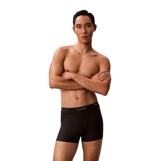 Slip Mare Calvin Klein Vita Media; Nero. Jersey di nylon elasticizzato "Quick Dry". Doppia fascia logata tono su tono, interamente foderato, tessuto anti-umidità Vista frontale 