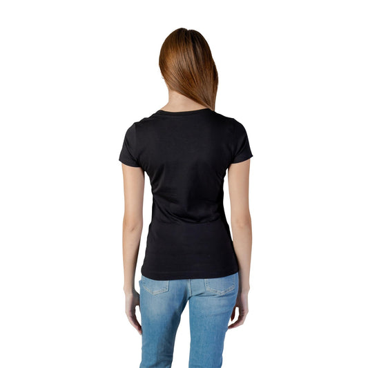 T-shirt Guess Camelia Triangle; Nero. Cotone elasticizzato, vestibilità slim. Logo con strass applicati, girocollo, maniche corte. Stile iconico e femminile. Vista posteriore 
