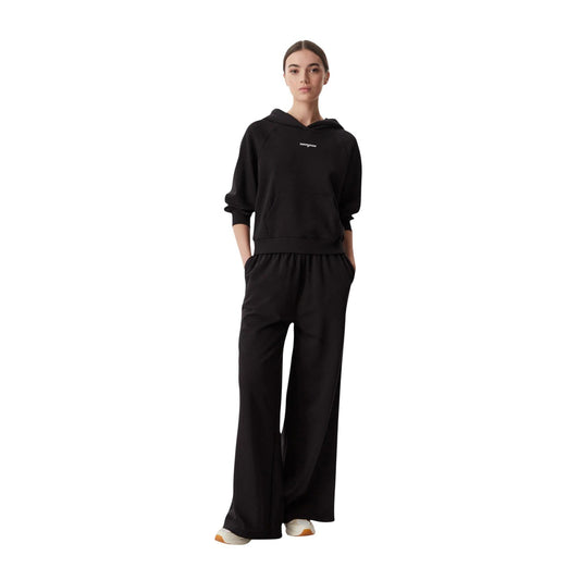 Pantaloni Tuta Donna Neri Tommy Hilfiger Jeans; Pantalone a gamba ampia wide leg in cotone e poliestere riciclato. Vita elastica regolabile, tasche laterali e logo ricamato. Stile casual e sportivo. Frontale intera 
