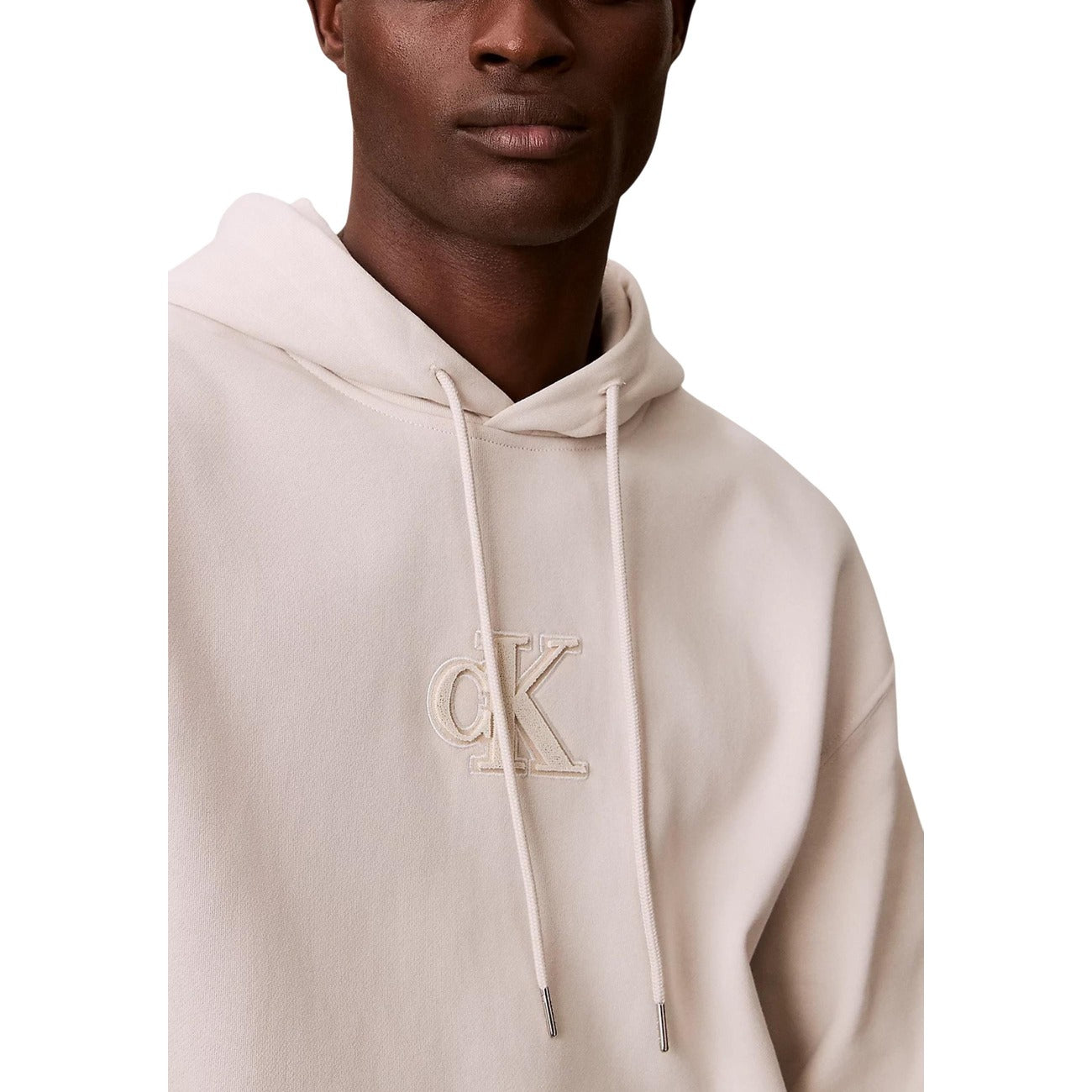 Felpa Relaxed Calvin Klein Monogram; 100% Cotone. Cappuccio con coulisse, tasca a marsupio, logo grafico. Taglio ampio e moderno, tessuto in pile di alta qualità.Beige 