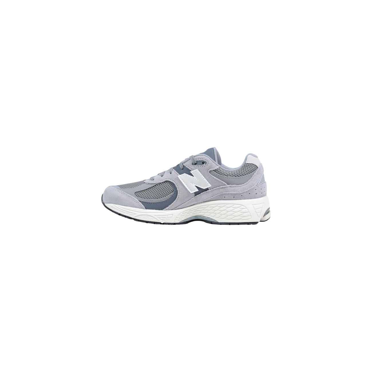 Sneakers New Balance 2002R da uomo con tomaia multistrato in pelle scamosciata e mesh, design rétro running anni 2000 e intersuola tecnologica ammortizzata. Vista laterale 