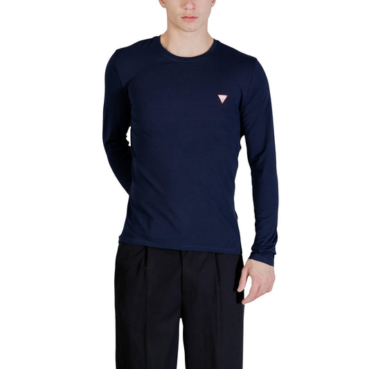 Guess LS Core Tee; 95% cotone, 5% elastan, logo discreto al petto. La t-shirt a maniche lunghe essenziale dal taglio contemporaneo. Colore blu scuro. Vista frontale 