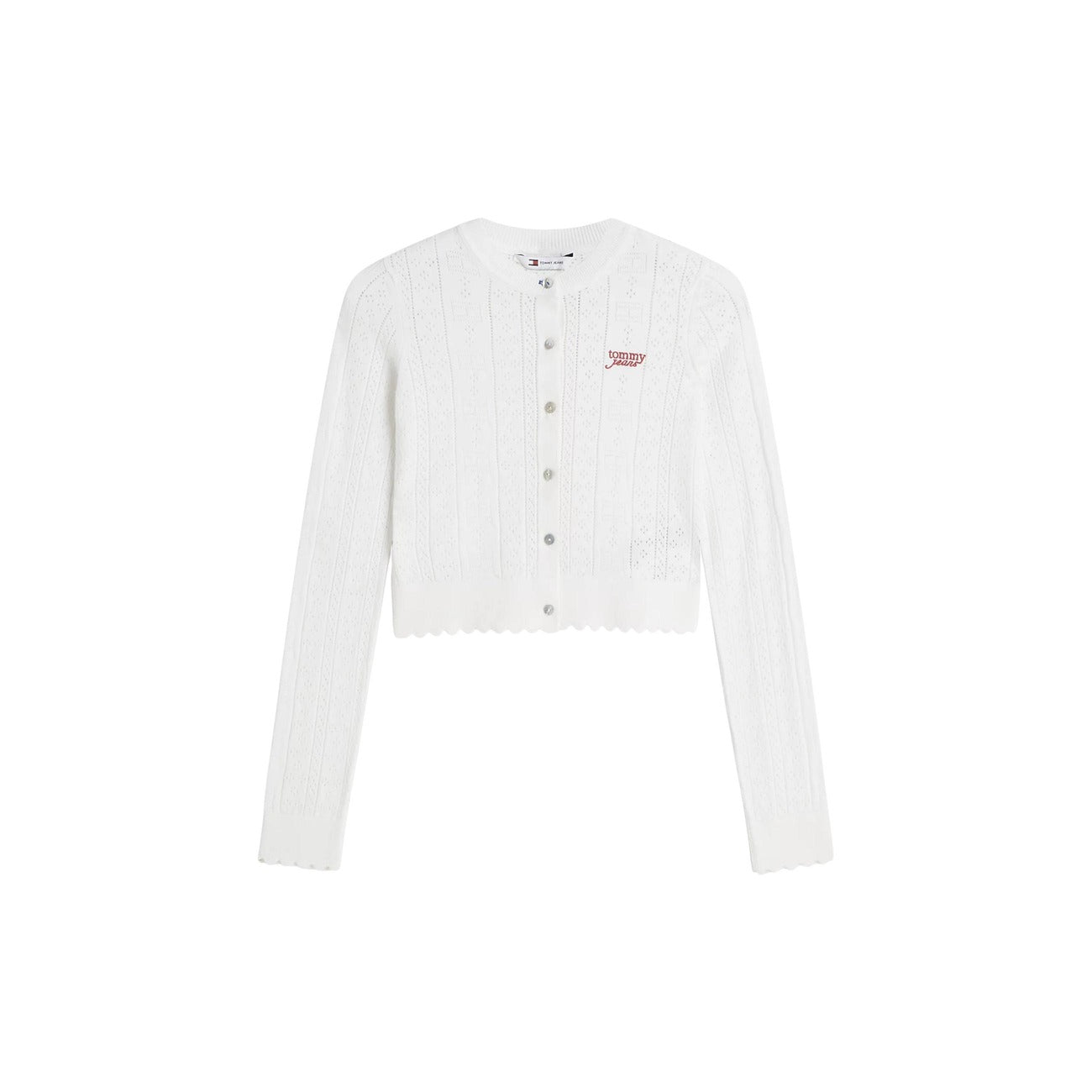 Cardigan Donna Bianco Tommy Hilfiger Jeans; Maglia slim fit traforata a maniche lunghe con bottoni, scollo tondo e motivo pointelle a bandierine. Dettagli smerlati, stile preppy casual e raffinato. Frontale stesa 