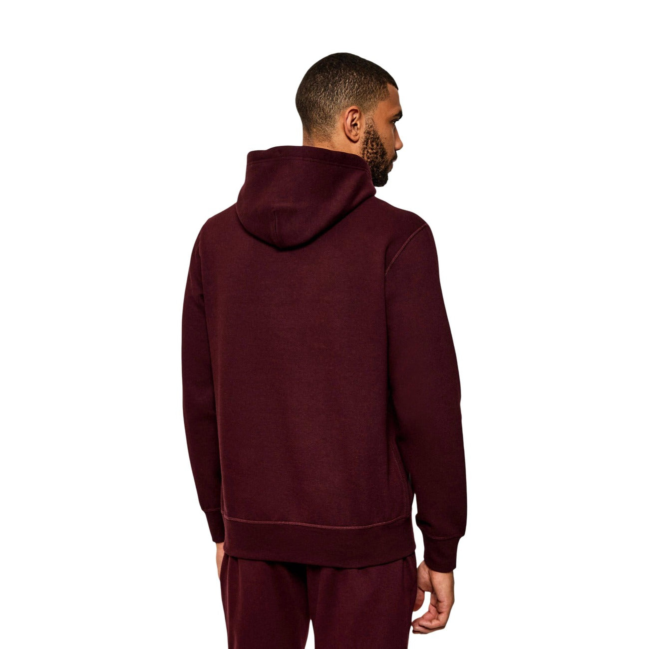Felpa Tommy Hilfiger uomo bordeaux con cappuccio MW0MW39997. Felpa in misto cotone spazzolato effetto manopesca con tasca a marsupio frontale, coulisse a contrasto e logo ricamato, abbigliamento uomo autunno inverno.
