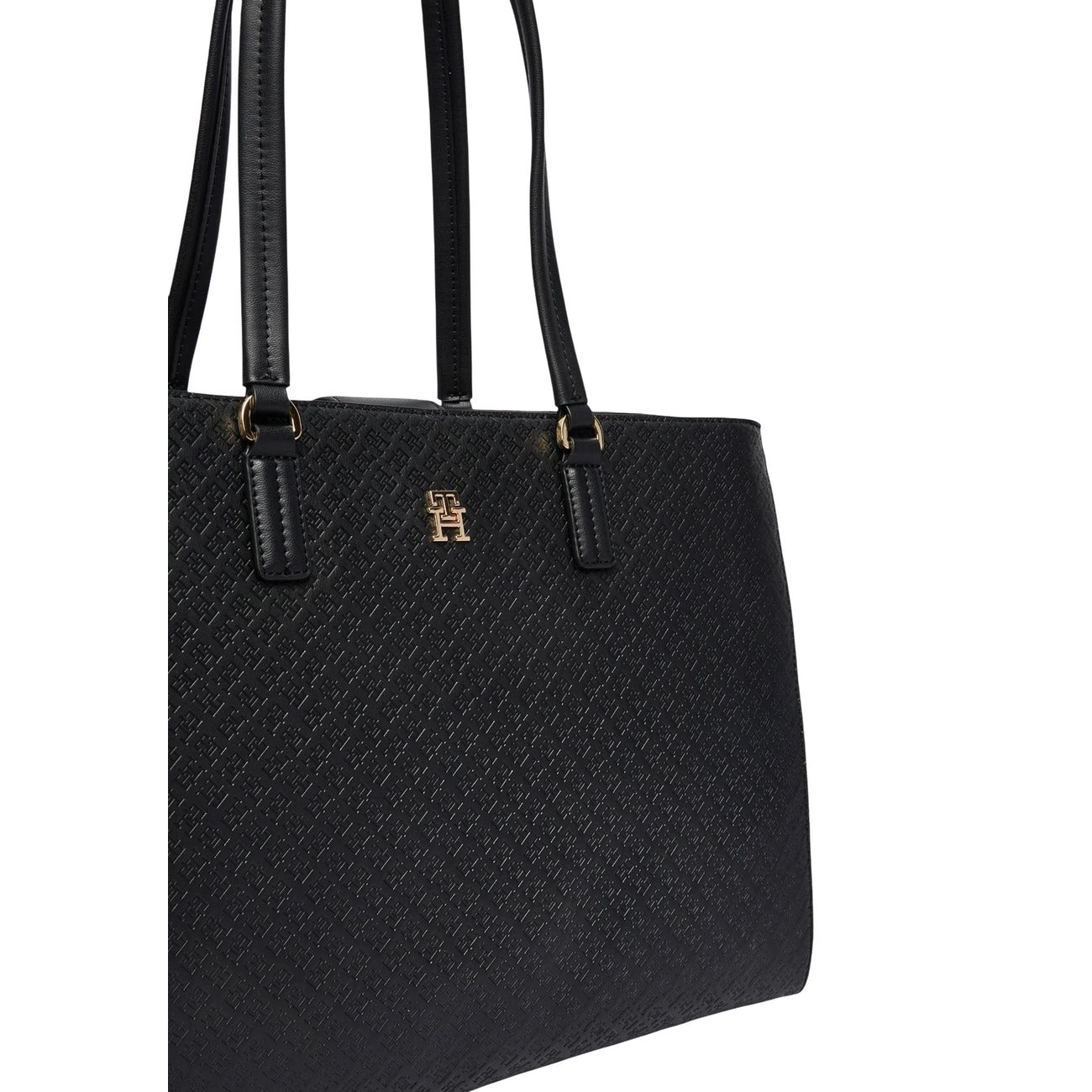 Tote Tommy Hilfiger; Monogramma TH in rilievo. Chiusura magnetica, due scomparti, tasche interne con zip. Borsa da ufficio capiente, elegante e rifinita nei minimi dettagli. Colore nero 
