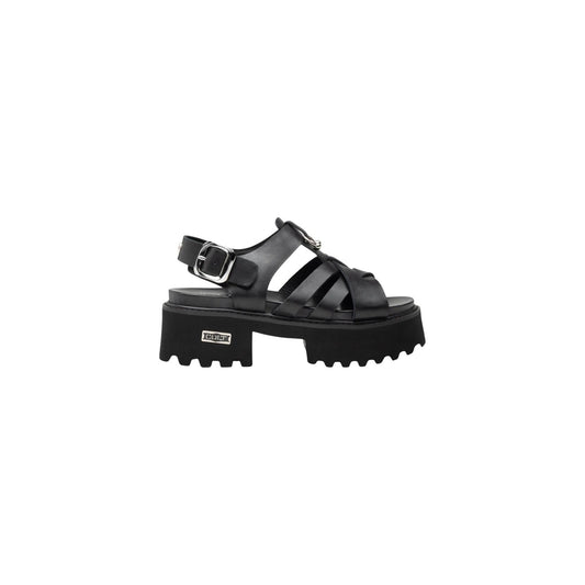 Cult Cher 4535; Sandalo Platform Intrecciato Nero. 100% Pelle, tacco 5 cm. Suola carrarmato robusta, chiusura alla caviglia, dettagli metallici iconici.