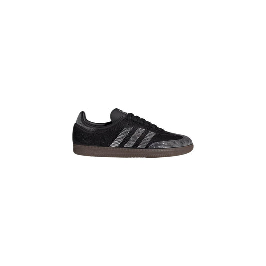 Sneakers neri donna adidas Originals Samba OG IH9052. Scarpe da ginnastica basse in pelle nera con dettagli scamosciati, strisce bianche Cloud White, scritta Samba dorata e suola marrone in gomma.