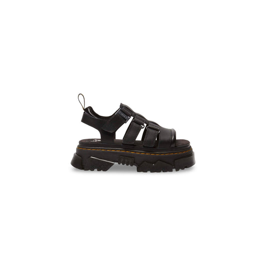 Dr. Martens Sandalo Mattison Platform; Nero. 100% Pelle Athena opaca. Tacco 5 cm, suola ibrida EVA/PVC, sottopiede in camoscio e chiusura a fibbia. Dettagli originali Dr. Martens con cuciture gialle.