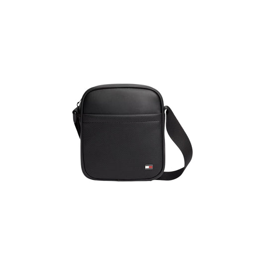 Tracolla nera uomo Tommy Hilfiger AM0AM14845BDS. Borsello reporter da uomo nero in ecopelle con tasca traforata frontale, zip, scomparto da 1,85 litri e logo bandierina Tommy Hilfiger.