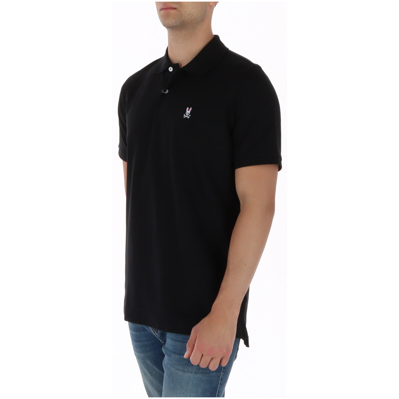 Polo Psycho Bunny Nera; 100% Cotone Pima Peruviano. Tessuto piqué a maglia romboidale, bottoni in madreperla, logo ricamato e colletto anti-arrotolamento. Qualità sartoriale Made in Peru, traspirante e resistente. Laterale 