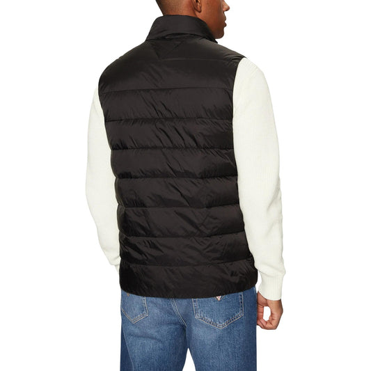 Gilet Tommy Jeans Down Ext; 100% poliammide, imbottitura piumino tech, colletto alto. Logo applicato, zip frontale, vestibilità moderna. Colore nero. Vista posteriore 