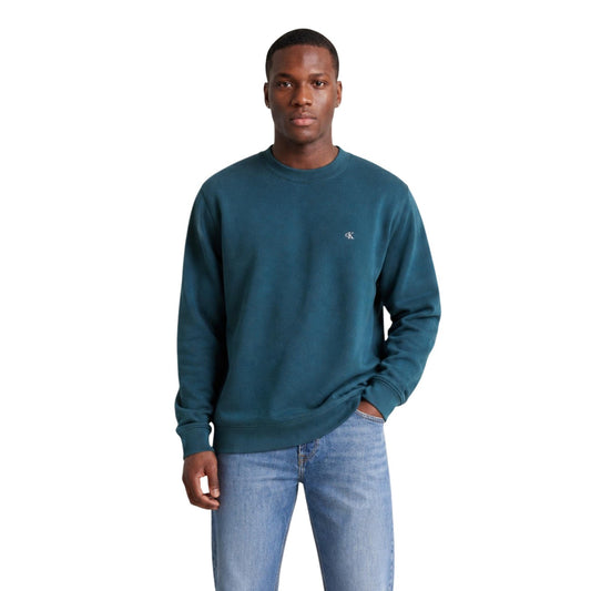 Maglione Verde Calvin Klein Jeans; 100% Cotone. Girocollo, logo CK ricamato, polsini a costine. Tinta unita, stile casual-premium, ideale per la mezza stagione. Frontale 