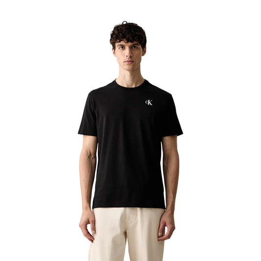 T-shirt Calvin Klein Jeans uomo nera LV04RH815G. Maglietta casual a manica corta girocollo vestibilità regolare, 100% cotone traspirante con logo cK frontale e stampa logo esteso sul retro.