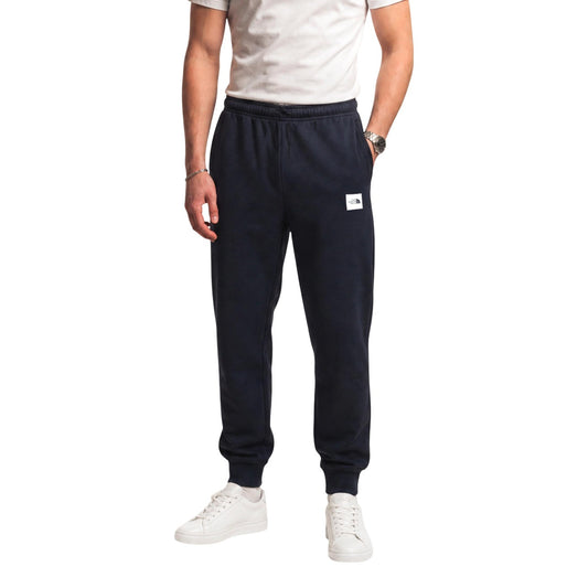 Pantaloni tuta The North Face uomo neri modello M EVO BOX HD REG PNT T. Pantalone jogger felpato nero con coulisse in vita, polsini alla caviglia e doppio logo applicato davanti e dietro, stile casual, sportivo e streetwear.