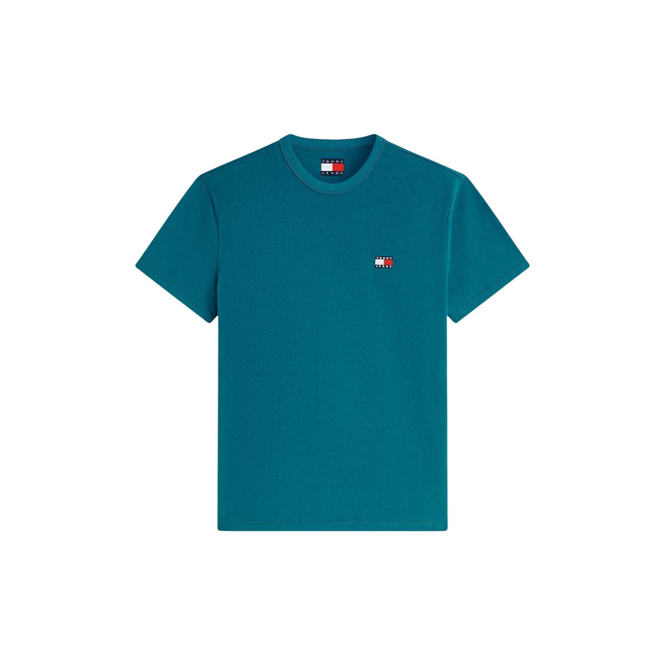 T-shirt Verde Tommy Jeans; Logo Badge Ricamato. 100% Cotone Rigenerato. Regular fit, girocollo classico, ecosostenibile. Il basic premium ideale per ogni outfit. Vista stesa frontale 