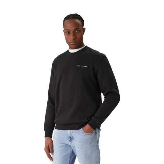 Felpa Tommy Hilfiger Jeans uomo girocollo nera DM0DM20249. Felpa casual in cotone felpato con scollo tondo, finiture elasticizzate a costine e scritte logo Tommy Jeans ricamate sul petto, abbigliamento uomo autunno inverno.