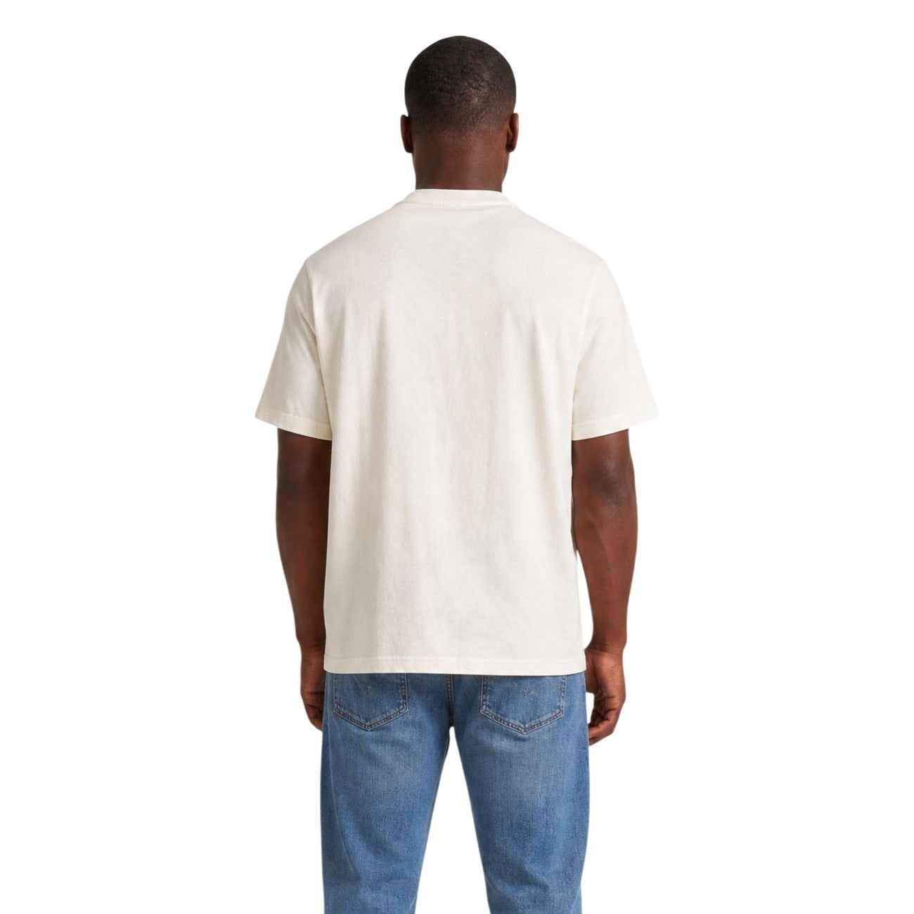 T-shirt Bianca Tommy Jeans; Maxi Logo frontale. 100% Cotone Rigenerato. Regular fit, girocollo, maniche corte. Fresca, iconica ed eco-friendly. Vista posteriore 