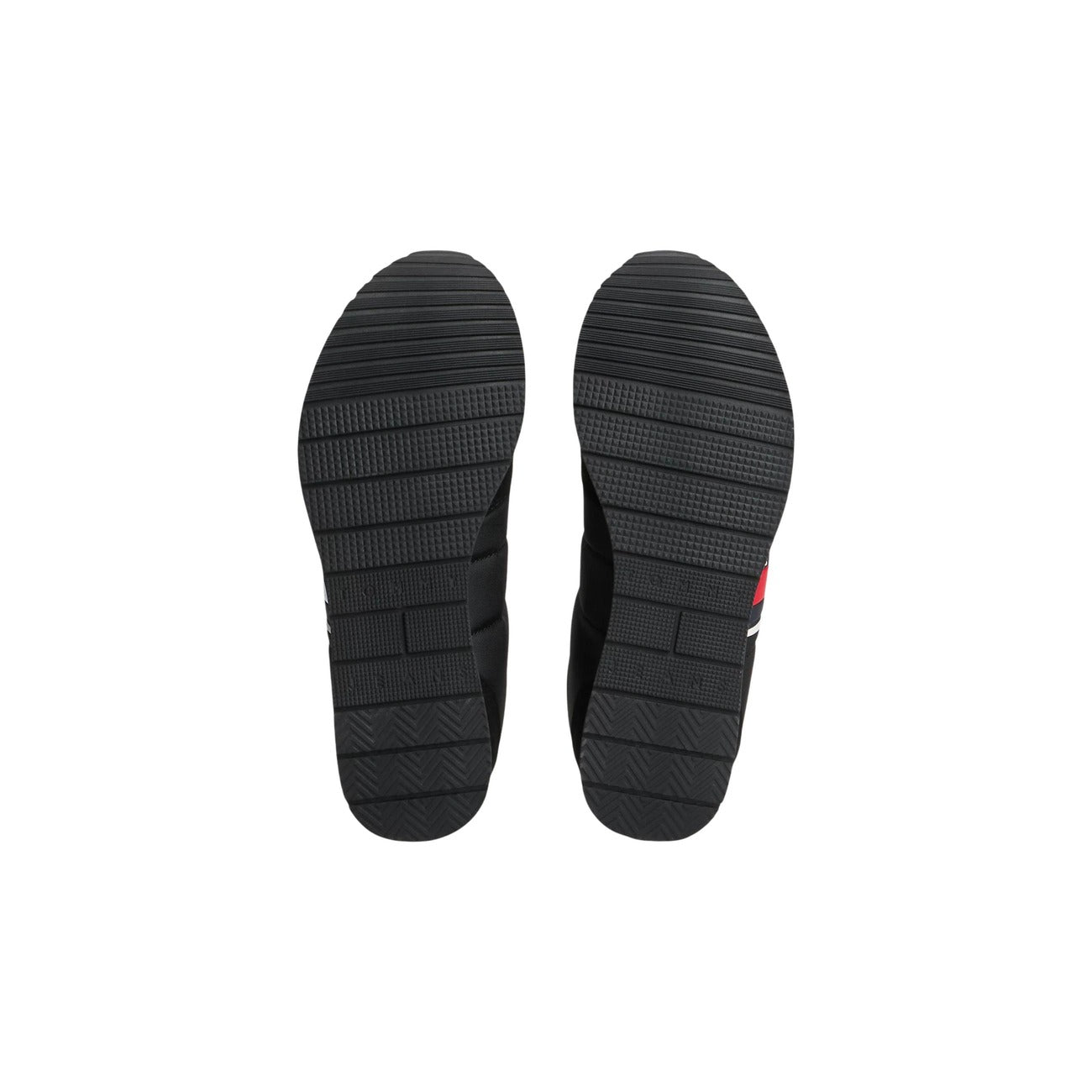Sneakers Tommy Jeans uomo nere EM0EM01709. Scarpe sportive basse tipo runner con suola in gomma ed EVA, tomaia multimateriale nera, inserti a contrasto e logo Tommy sulla linguetta e sul lato.
